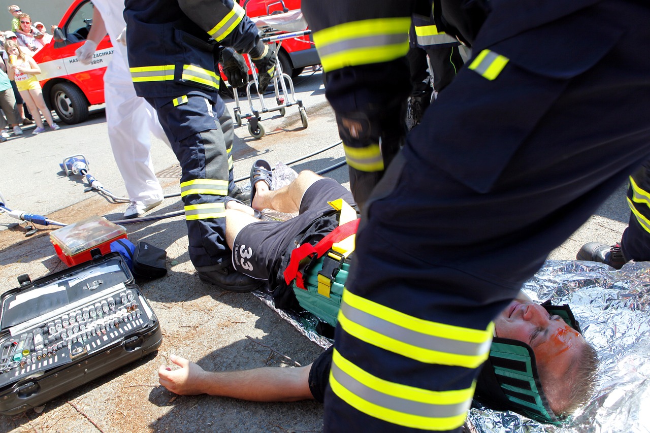 Firefighters providing medical attention delivered to patient